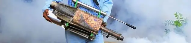 Fumigation technician using a fogger for deep pest treatment in Springfield, MO